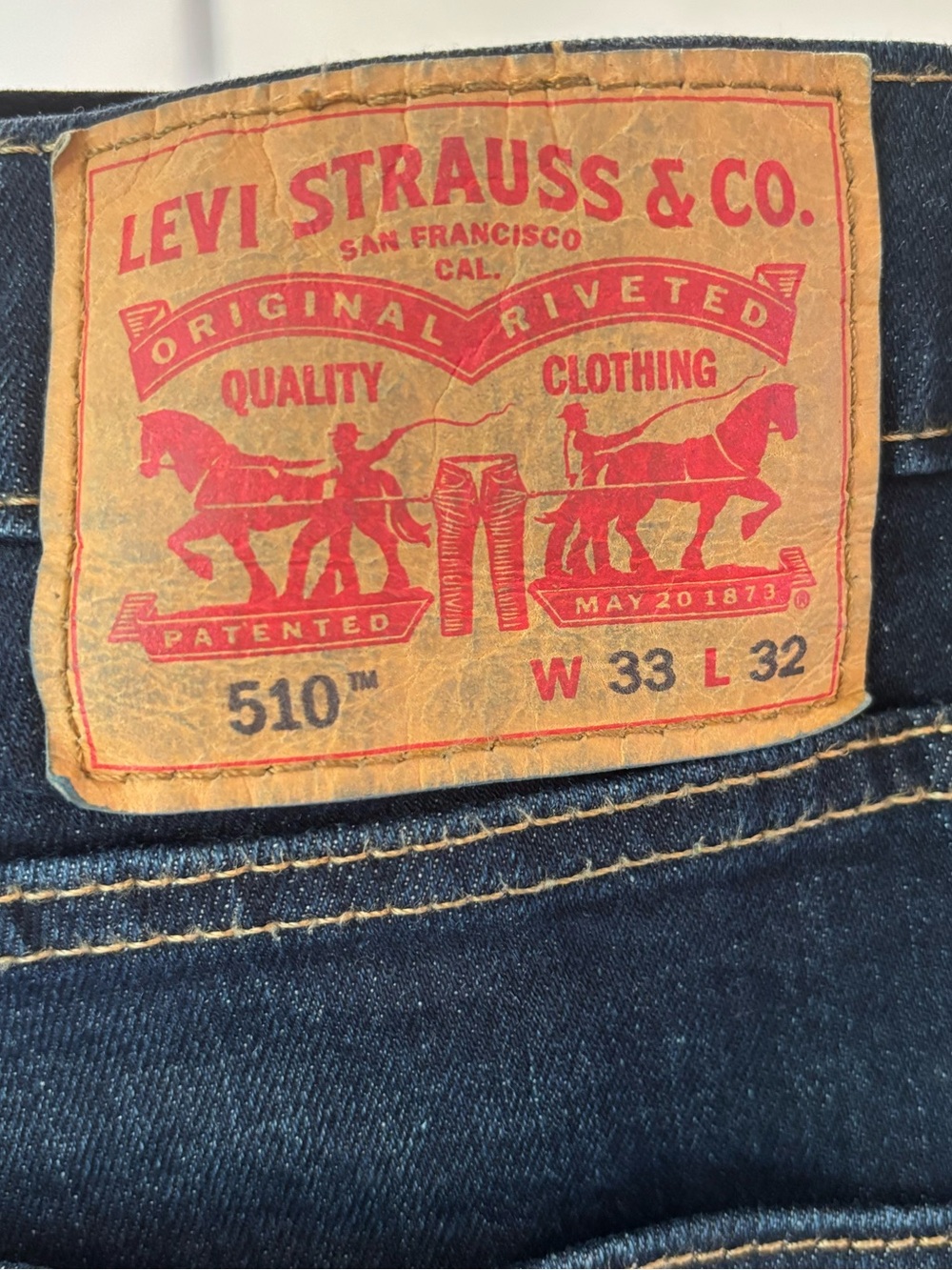 Levi's Slim Men's Jeans in Dark Blue Denim with Tan Leather Patch